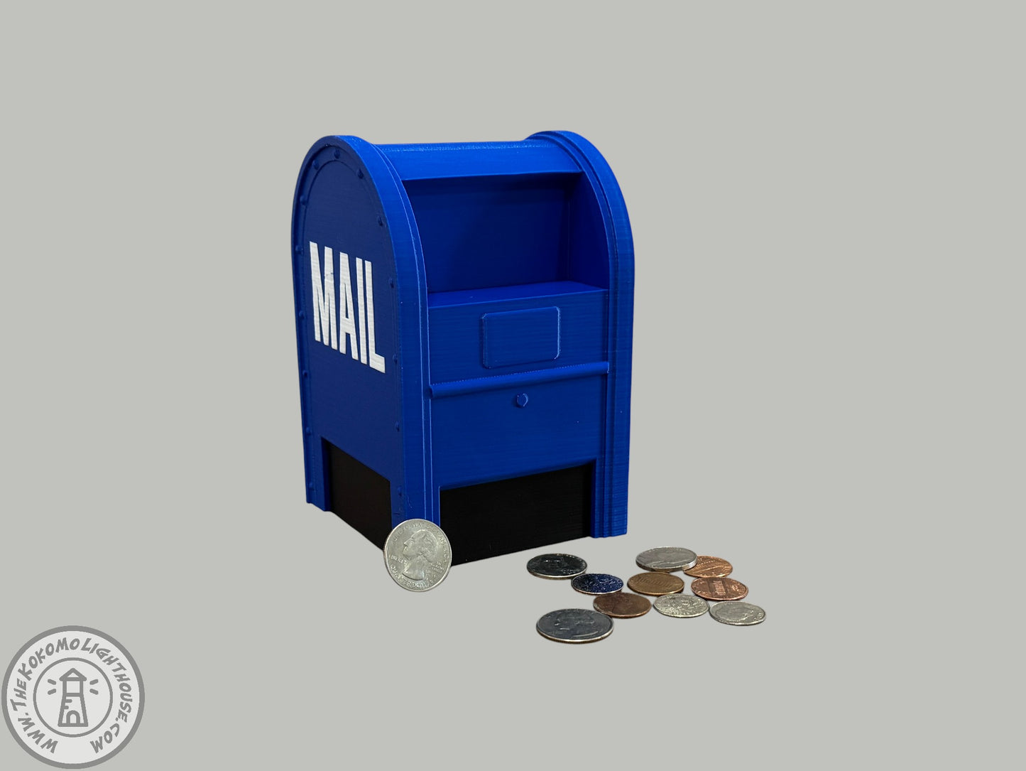 Blue mailbox piggy bank with coins on a gray background