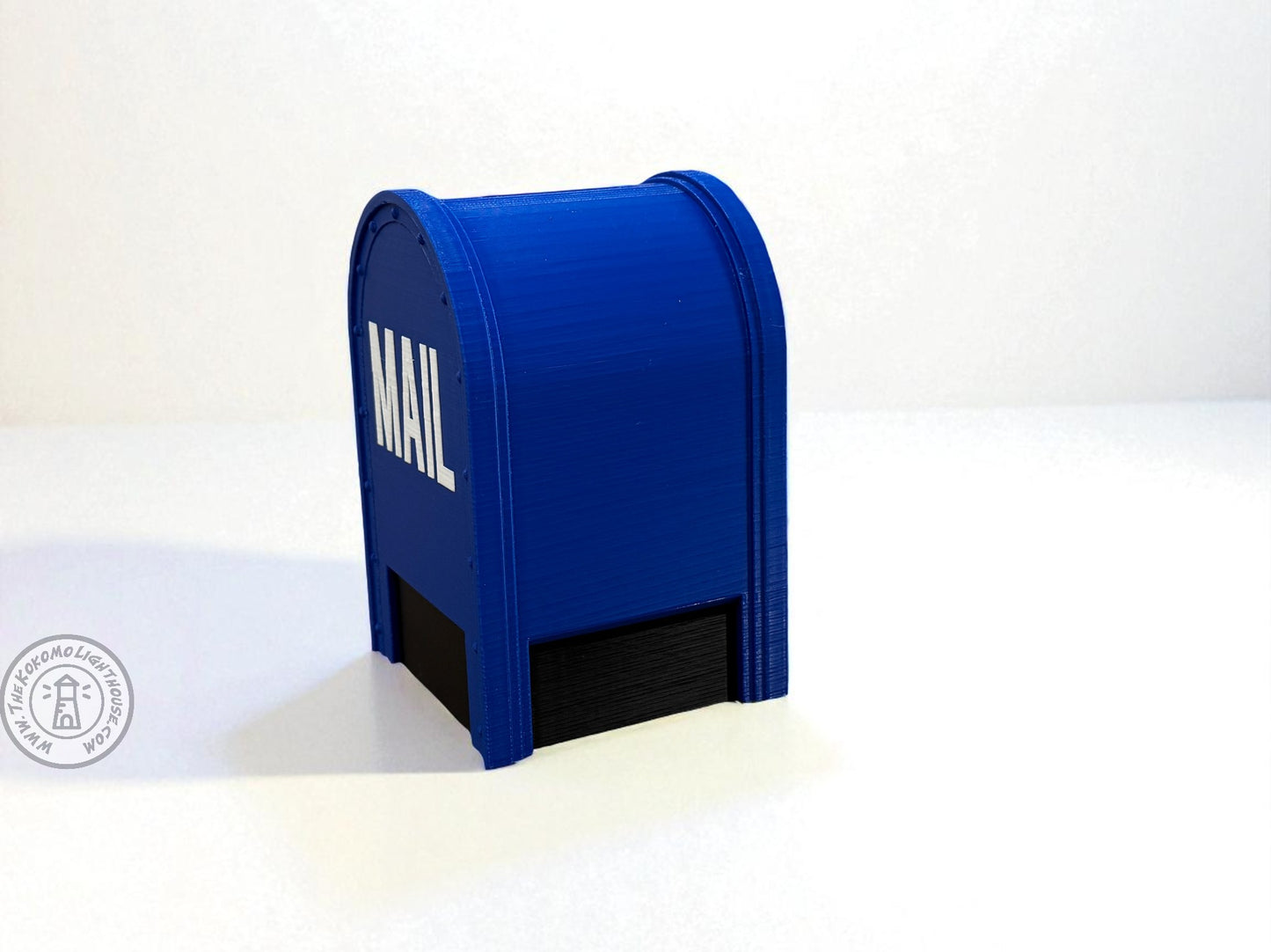 Blue mailbox piggy bank with 'MAIL' label on a white background
