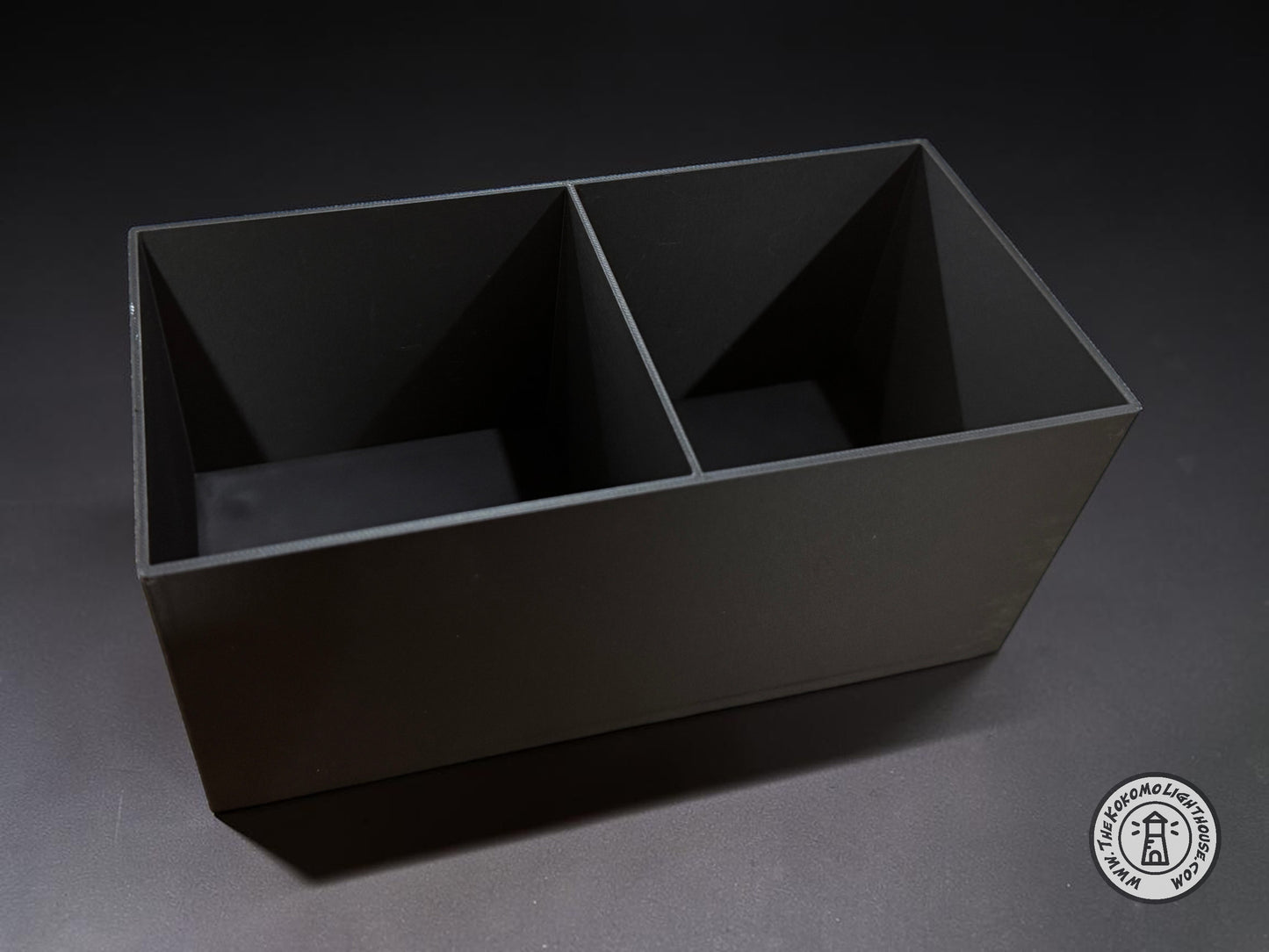 An empty fork truck caddy showing it without a drink holder on a dark gray background.