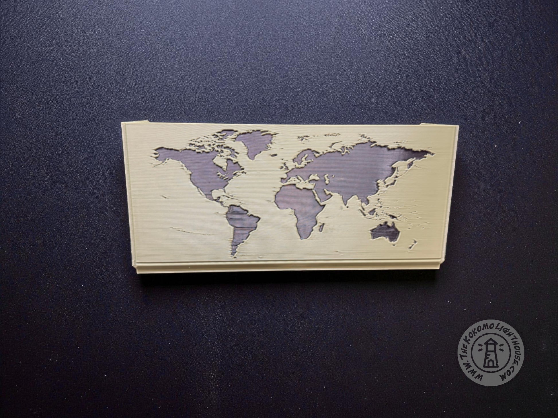 Green map box back showing a black world map