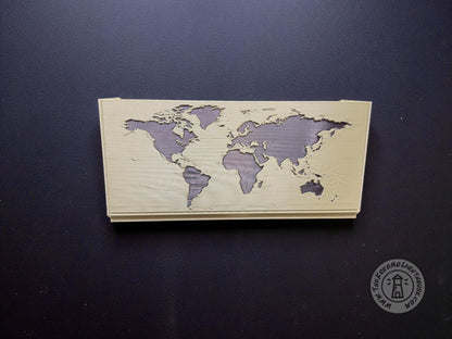 Green map box back showing a black world map