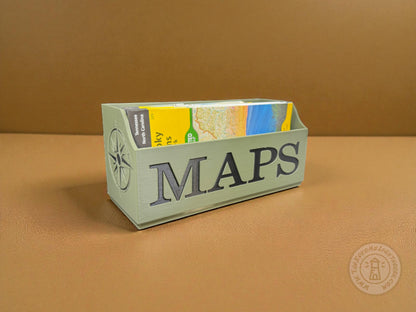 Green NatGeo Map box labeled 'MAPS' in black filled with maps  on a brown background