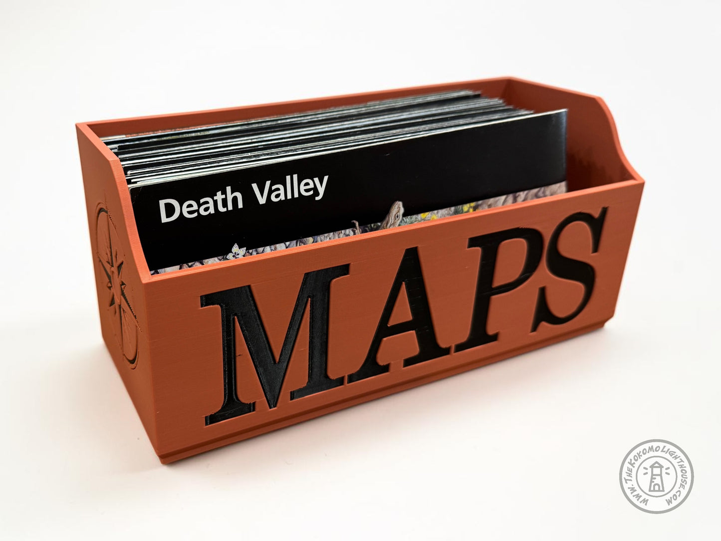 Terra Ctotta Map holder with 'Maps' text in black containing a unigrid map of Death Valley on a white background