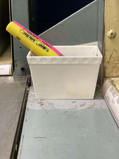 a mini mail tote on a postal case with two large highlighters