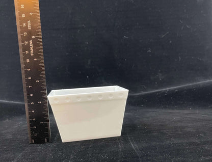 a plain mini postal tub with a vertical ruler showing it is 2.5" tall