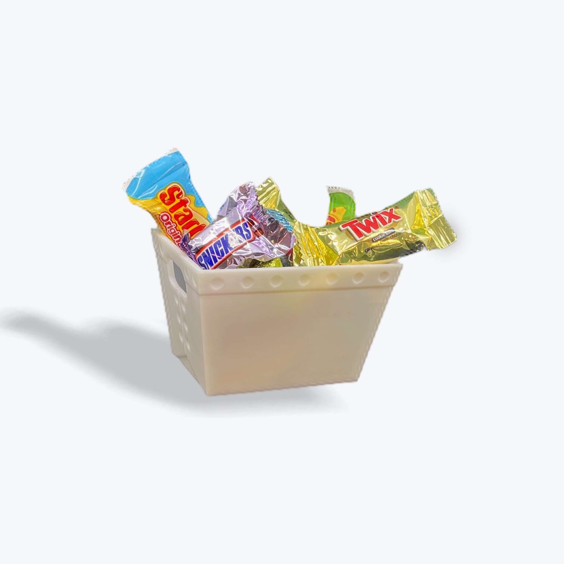 a plain white mini mail tub filled with fun sized candies