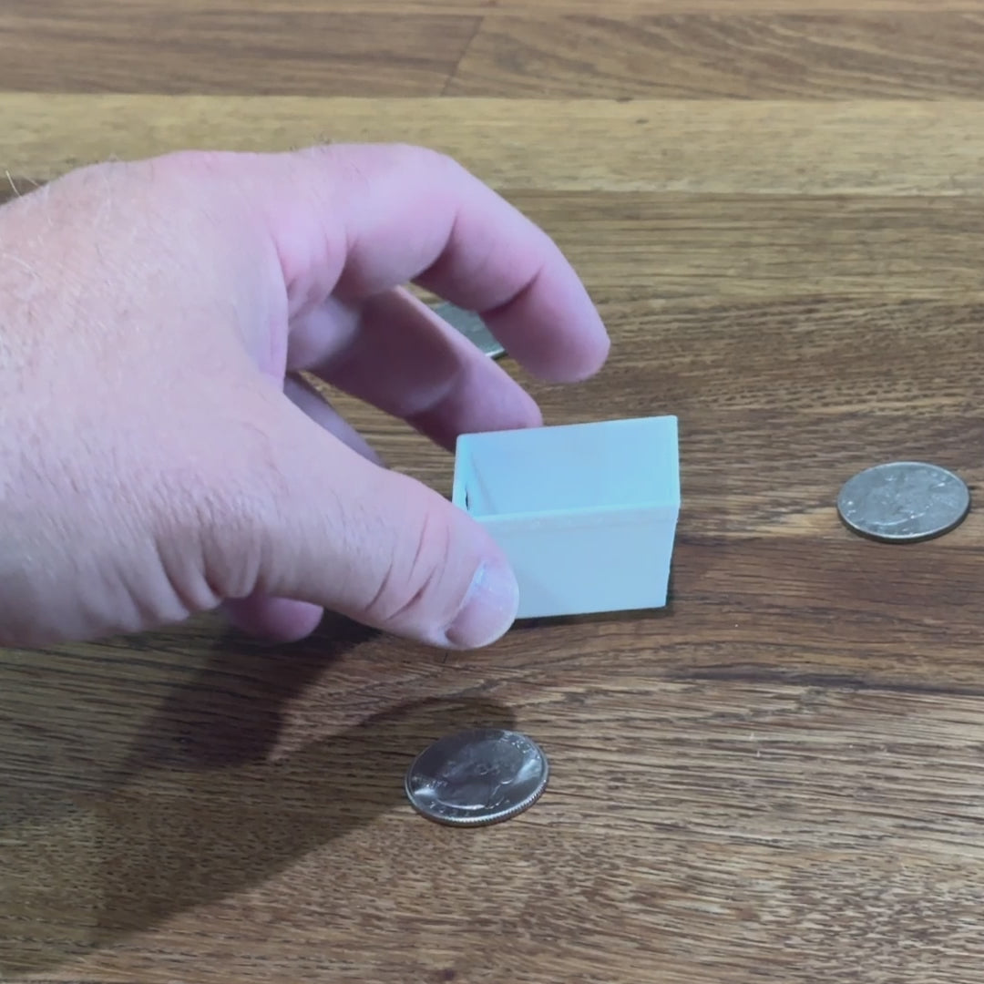 A short video showing the dollhouse postal tub being rotated and compared to a quarter