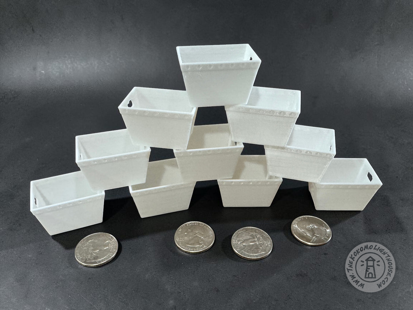 10 dollhouse scale dps trays on a gray background with a quarters for size comparison